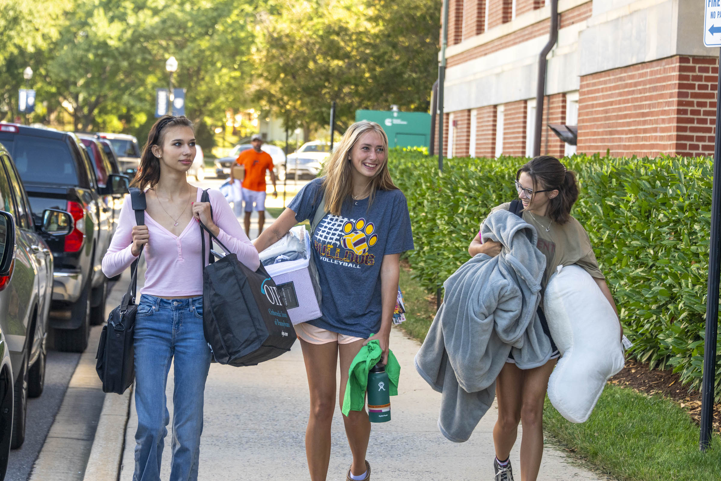 A Hood student and friends move bags into Meyran Hall
