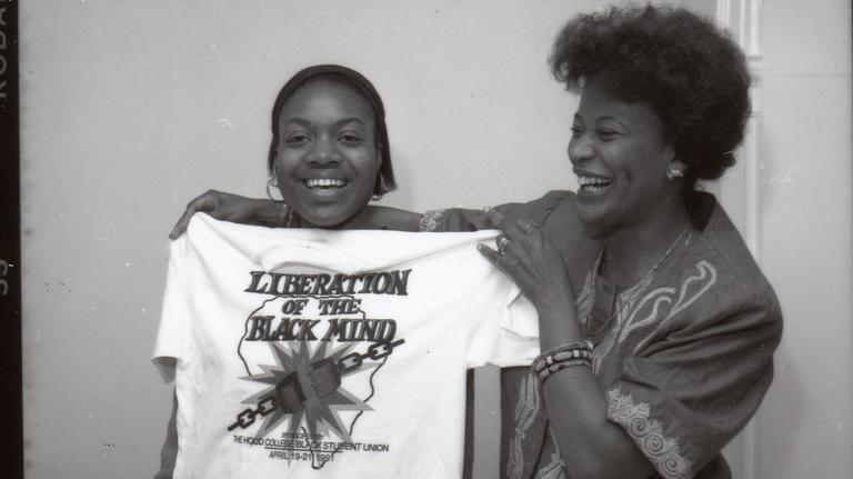 Students pose with a Liberation t-shirt (1991)