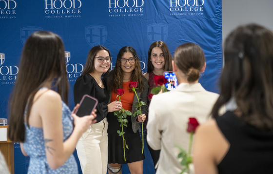 Tischer Scholars pose for a photo with their roses