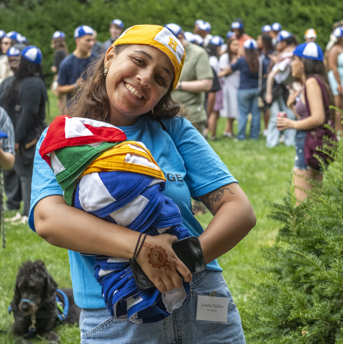 Hood student holding dinks.