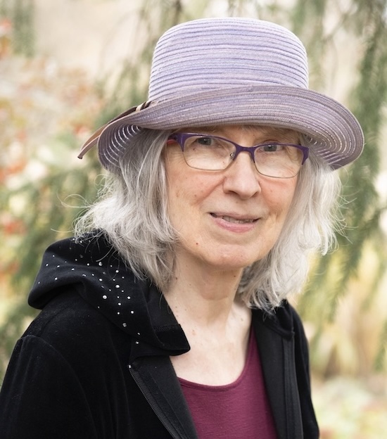 janet jai standing against natural backdrop