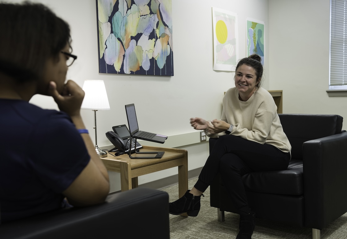 A counseling student conducting a practice therapy session.