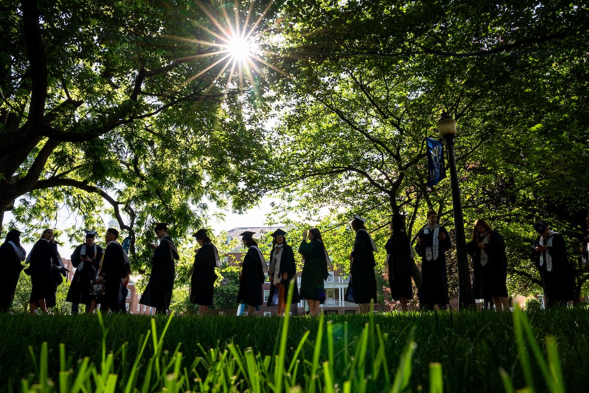 Hood College graduates process on the residential quad during the 2025 Commencement ceremony