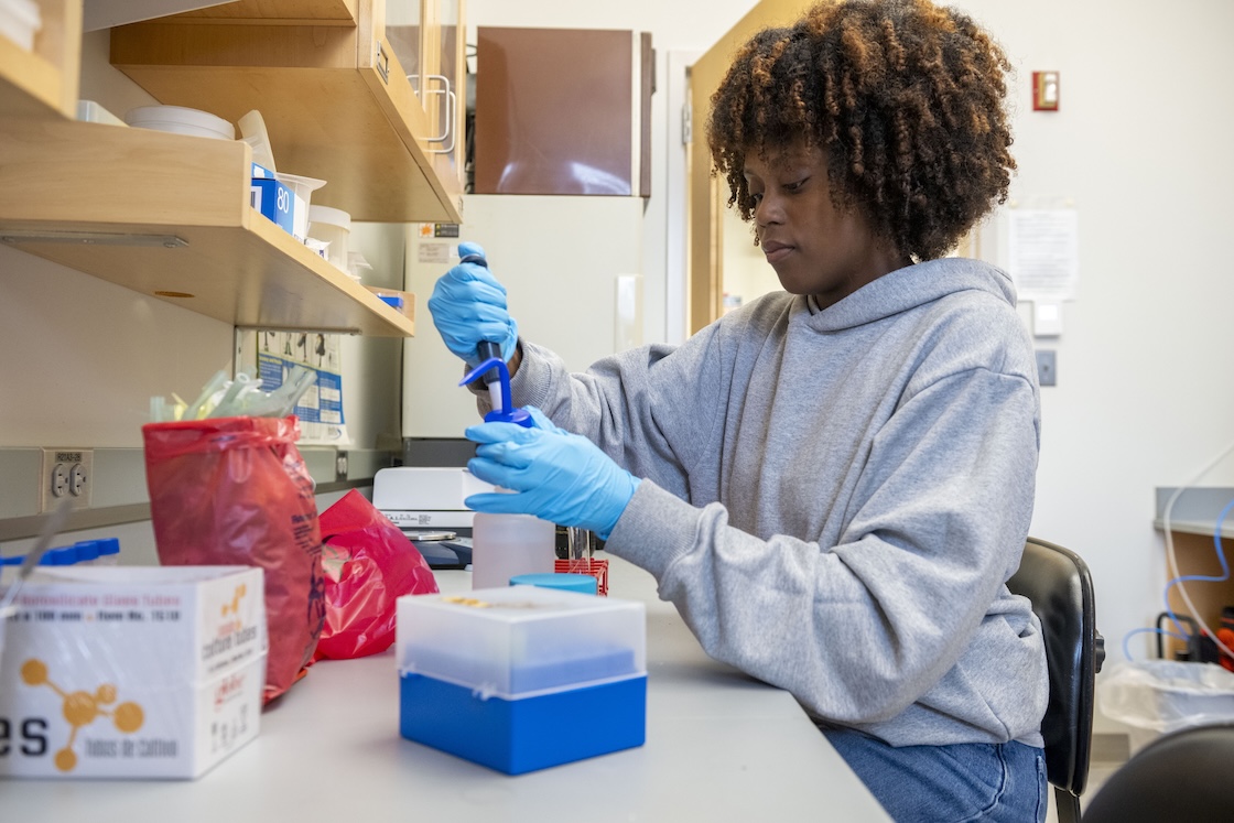 Elisha Kabongo '27 conducts research in a lab at Hood.