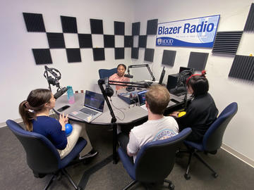 Students recording an episode of Blazer Radio in the recording studio