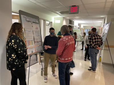 Students at poster session with community members