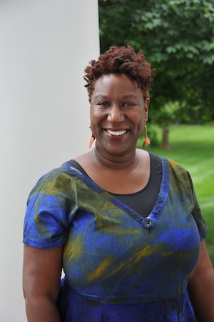 Headshot of Dr. Tamelyn Tucker-Worgs, taken outside in front of a white column