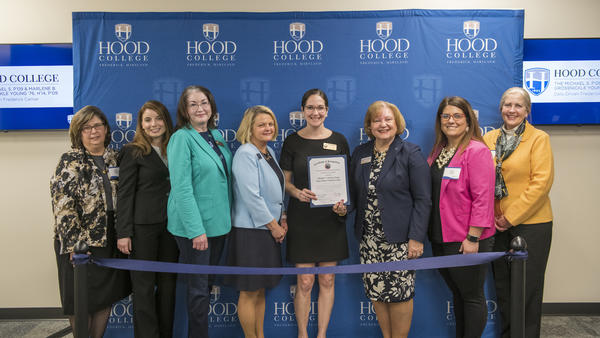 County Executive Jessica Fitzwater M.S.'10 presents Hood with a certificate of recognition