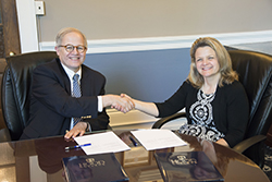 Ethan Dmitrovsky, director of the Frederick National Lab, and Hood President Andrea Chapdelaine