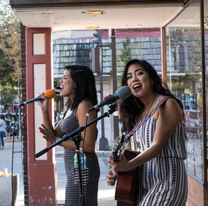 Artists performing music in downtown Frederick