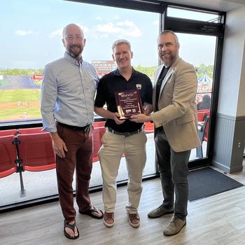 David Gurzick, Ph.D., accepts the BRAVO! Award at Harry Grove Stadium