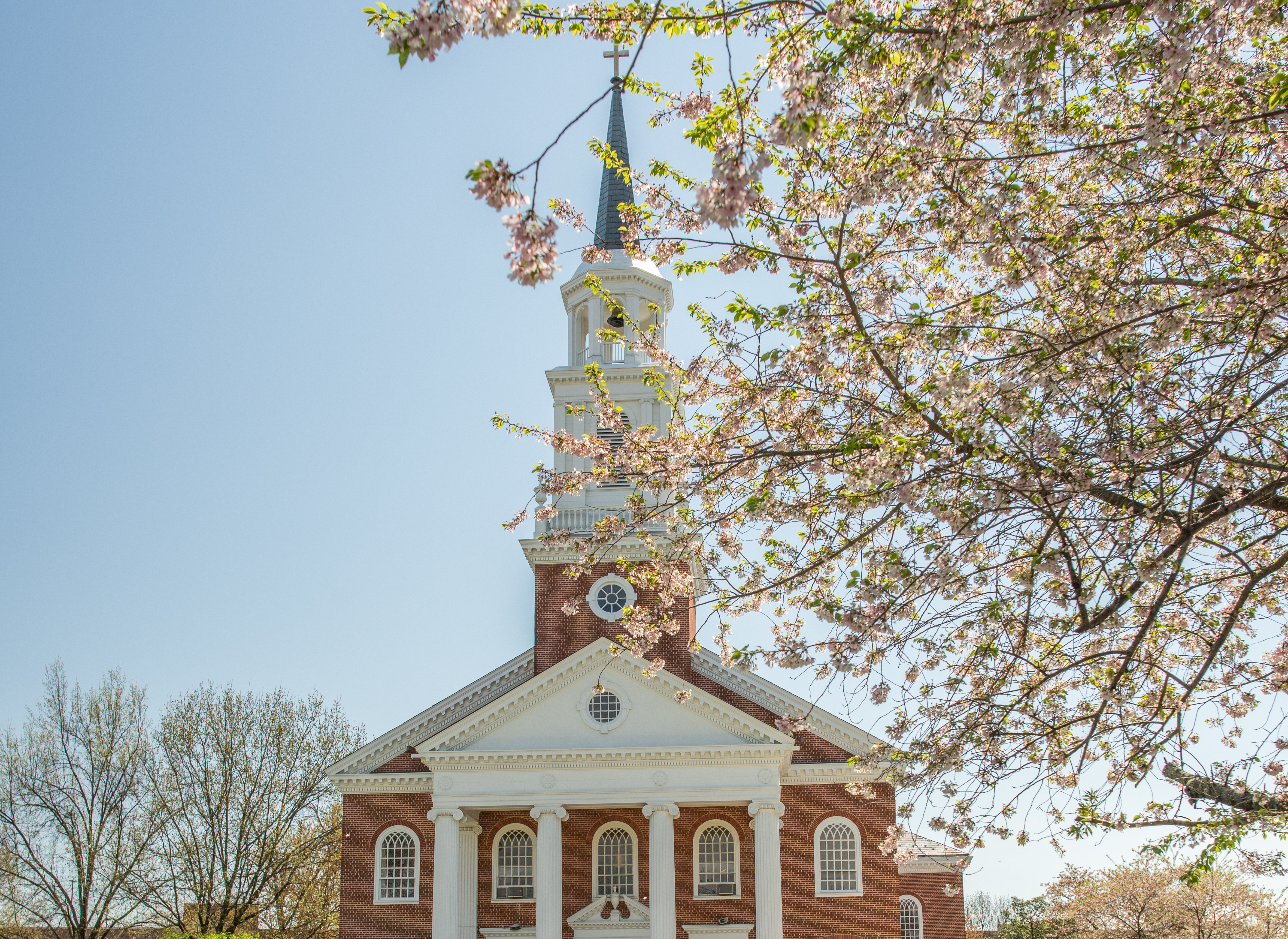 A spring scenic featuring the Coffman Chapel on Hood College's campus surrounded by blooming trees