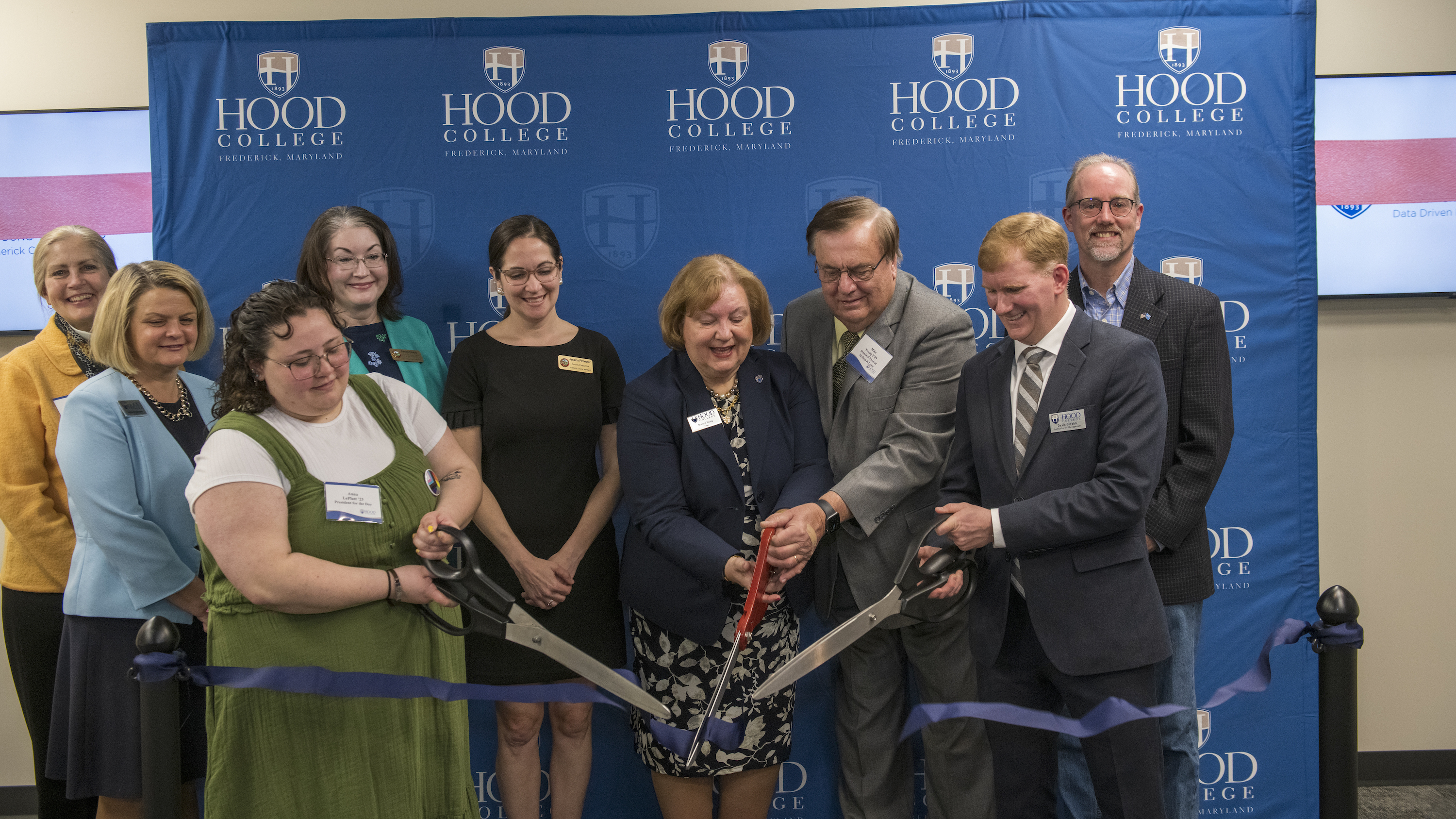 (L-R) Frederick County Council Member MC Keegan-Ayer, President Andrea E. Chapdelaine Ph.D., Anna LePlatt '23, Frederick County Council Member Renee Knapp, County Executive Jessica Fitzwater M.S.'10, Marlene B. Grossnickle Young '76, H'14, P'09, Michael S. Young P'09, Chair of the George B. Delaplaine School of Business David Gurzick M.S.'03, Ph.D., Frederick City Mayor Michael O'Connor