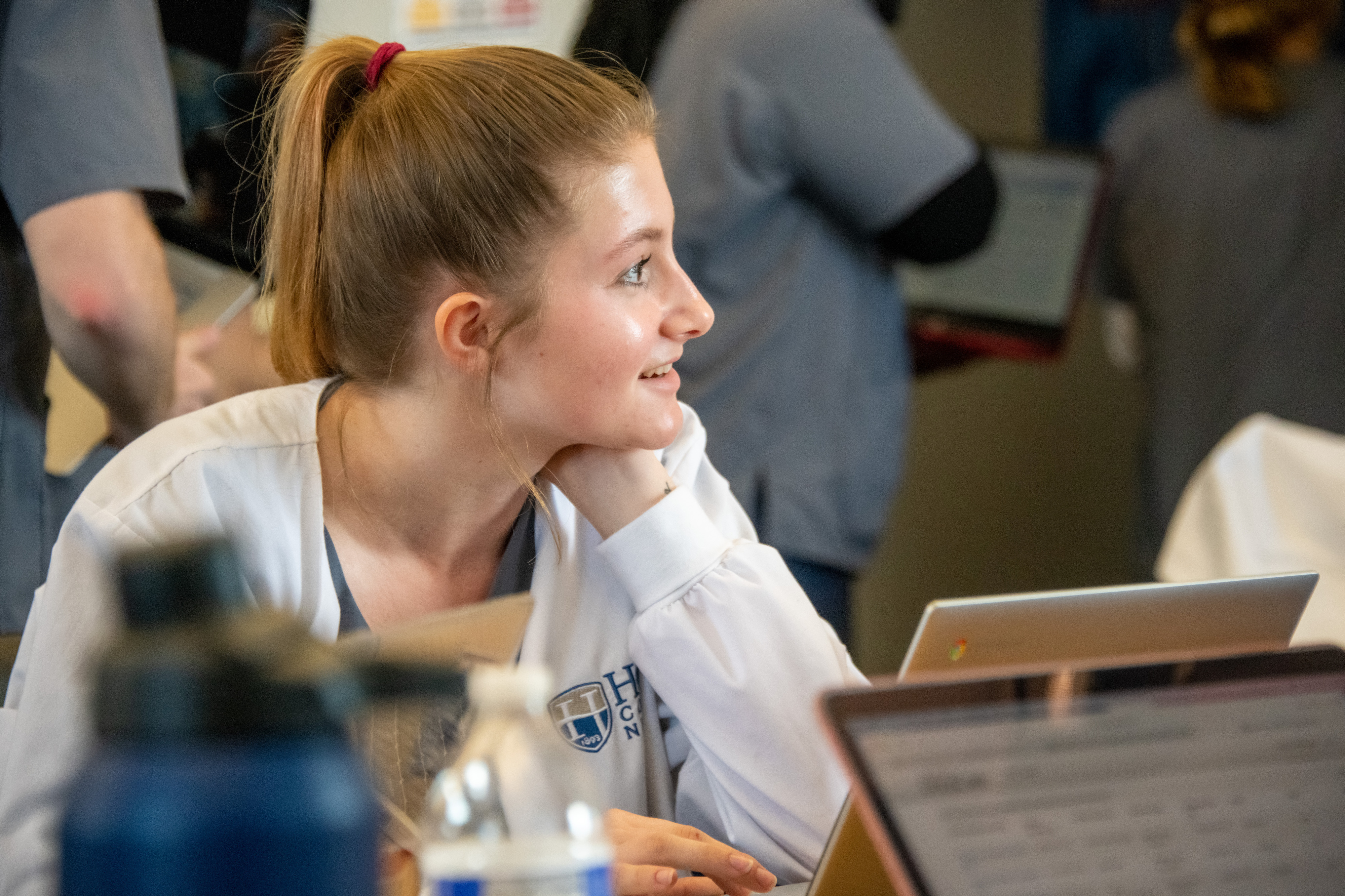 An undergraduate Hood College Nursing student listens to the instructor during a lecture