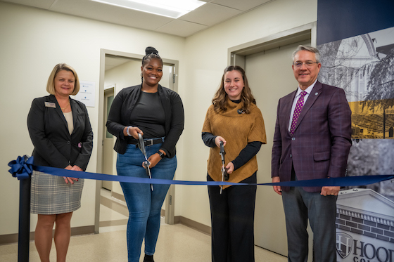 Andrea Chapdelaine, Tom Kleinhanzl and two students cut the ribbon at the SBHS opening ceremony.