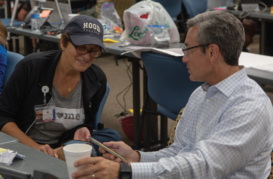 SMITH WORKING IN THE EMERGENCY OPERATIONS CENTER AND SPEAKING TO STATE SENATOR MICHAEL LEE