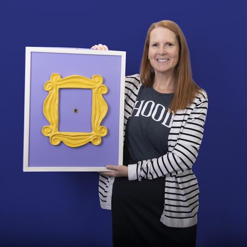 Laurie Ward Holding her Friends Poster