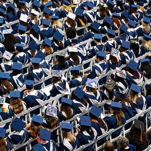Photo of Hood College graduates seated in the Woodsboro Bank Arena