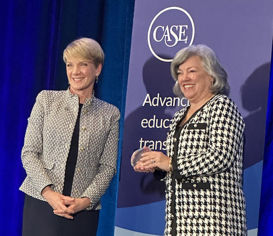 Nancy Gillece (right) accepts the CASE Award