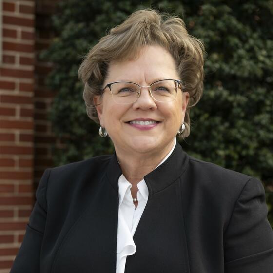 President Debbie Ricker, Ph.D., outside of Hood College's front entrance