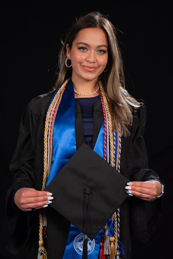 Hiba Usmani in Commencement regalia.