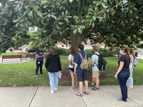 Participants around tree on Hood campus