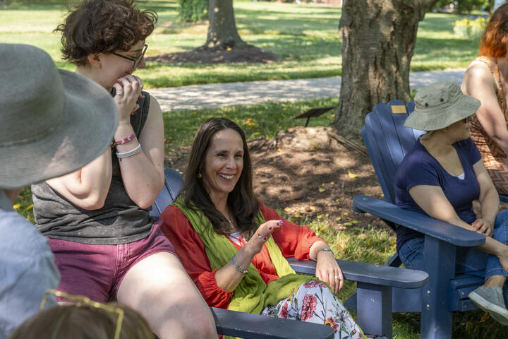 Creative writing students at an outdoor workshop.
