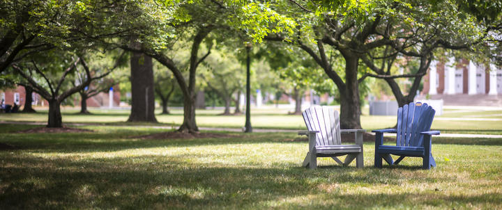 A pair of Adirondack chairs on the Quad.