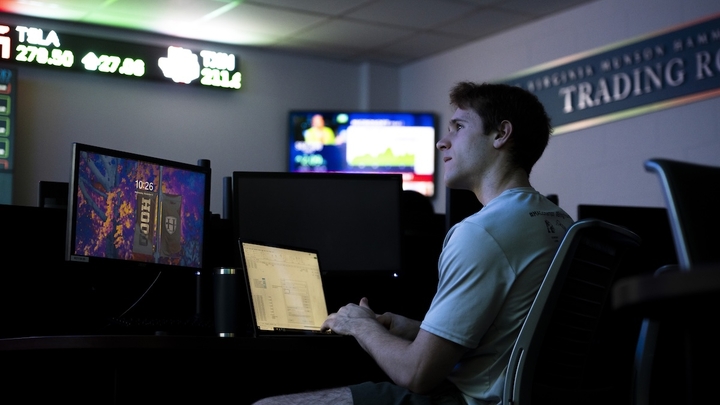 Hood student working at a computer in the trading room.