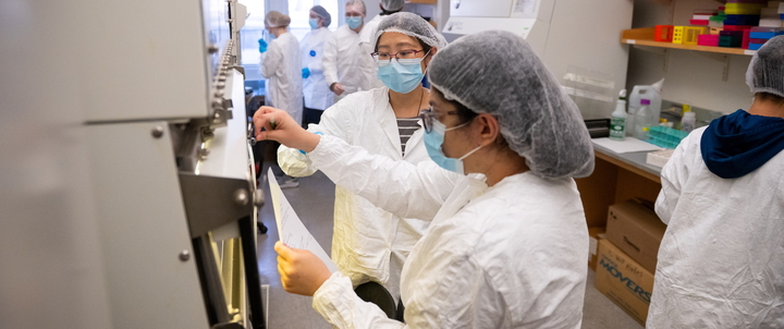 Hood students and faculty working in a lab on campus.