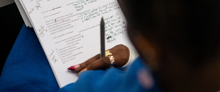 A student annotating a poem.