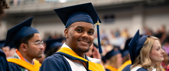 A Hood student wearing regalia at Commencement.