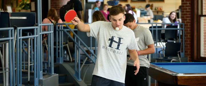 Student playing ping-pong