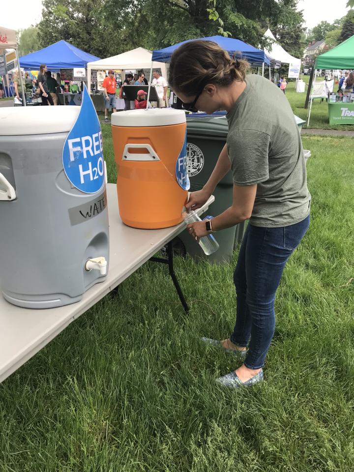 Student refilling bottle at water station