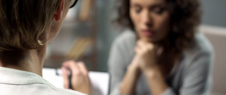 A female counseling student works with a female client.