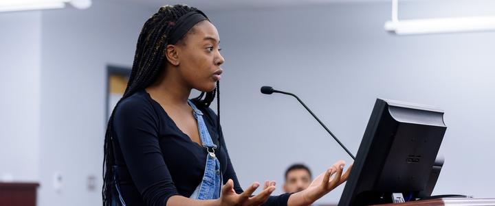 A student speaking at the moot courtroom.