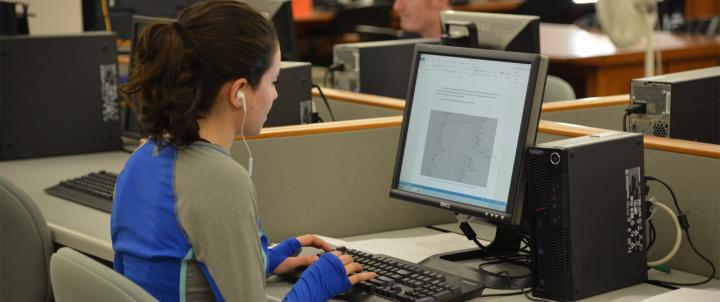 student in library