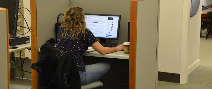 student in library