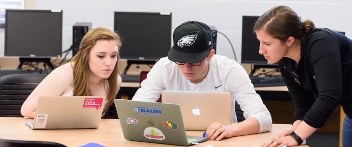 Students around computers