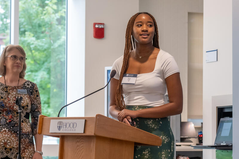 Student Presenting at Summer Research Showcase