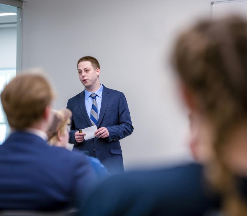 Male student presenting in class